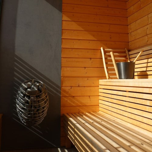 https://prod.cms.bathingbrands.com/sites/default/files/2022-01/huum-drop-sauna-heater-installed.jpg