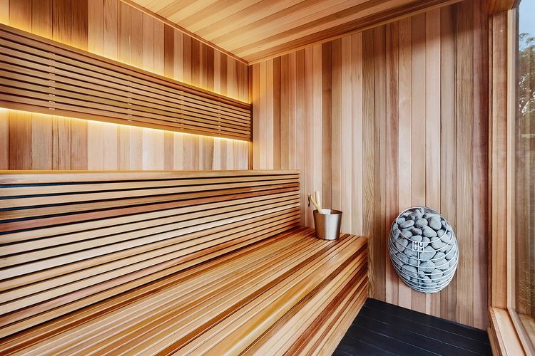 HUUM DROP heater installed in an outdoor sauna